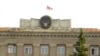 Nagorno-Karabakh - The Karabakh flag flies over the main government building in Stepanakert, 9Jul2011.